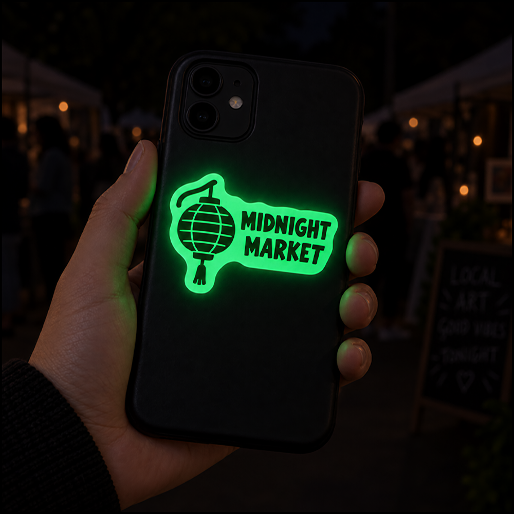 Glow in the dark sticker on a phone case at a night market